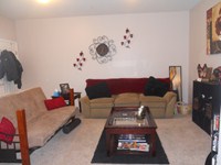 Living room in the larger one bedroom apt